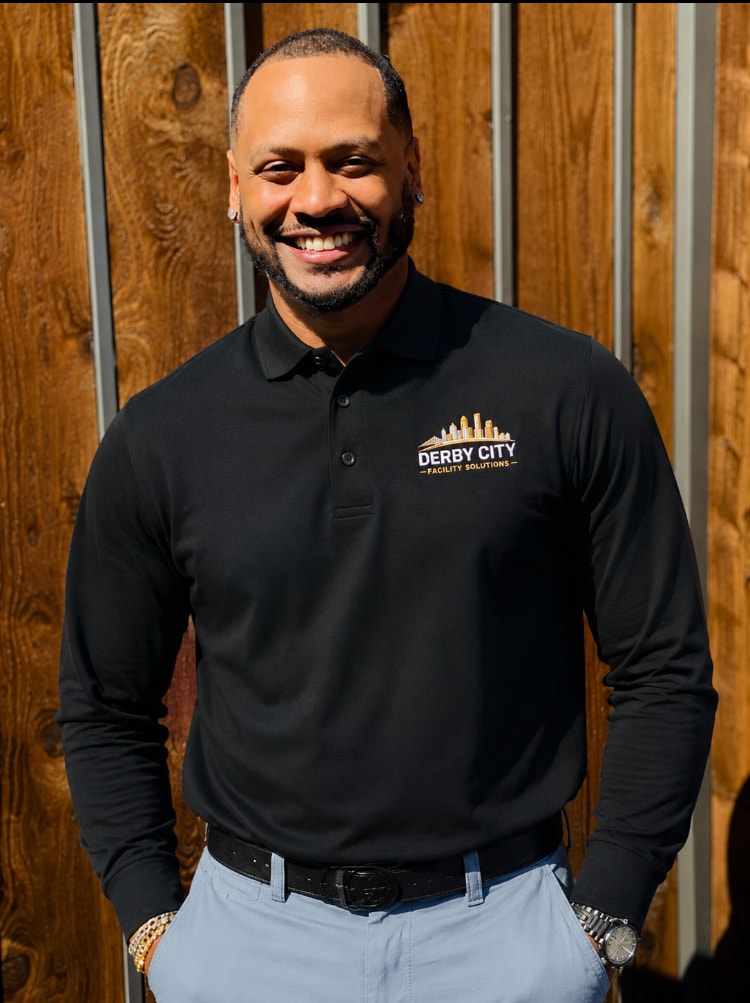 Derby City Facility Solutions team member in branded apparel